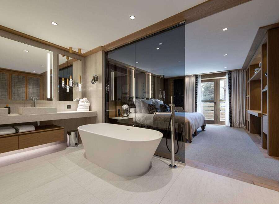 Experience luxury living in this stunning property featuring a spa-like bathroom with a modern soaking tub and elegant fixtures.