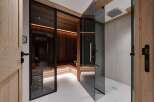 Step into luxury with this stunning property featuring a private sauna and a sleek, modern shower.