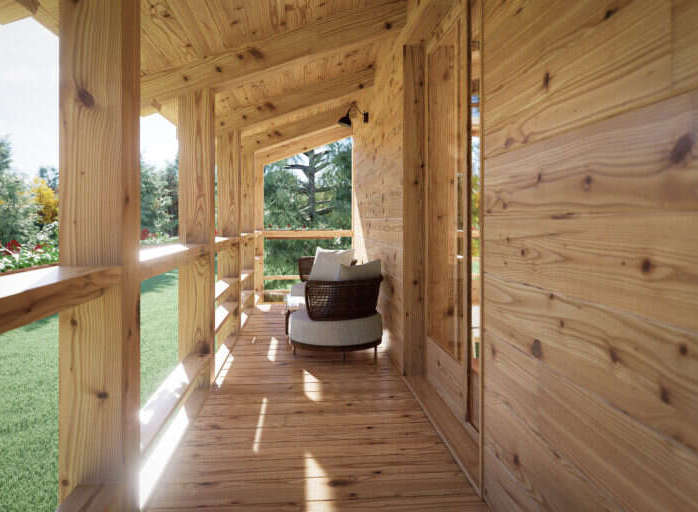 Relax on the spacious wooden deck overlooking a lush green landscape.