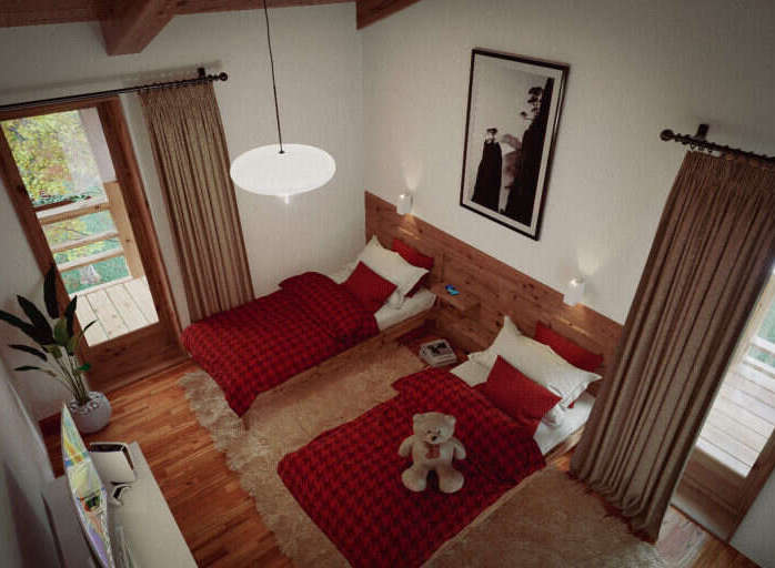 Cozy chalet bedroom with twin beds, red plaid bedding, and a teddy bear.