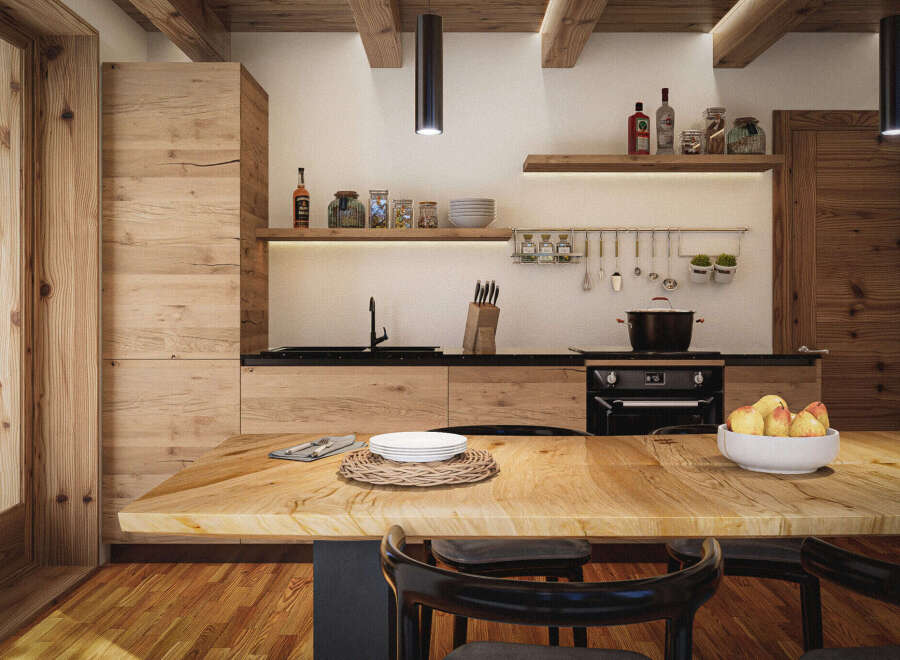 Rustic kitchen with wooden beams, wooden cabinets, and a large wooden table.