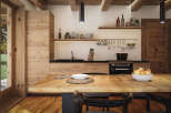 Rustic kitchen with wooden beams, wooden cabinets, and a large wooden table.
