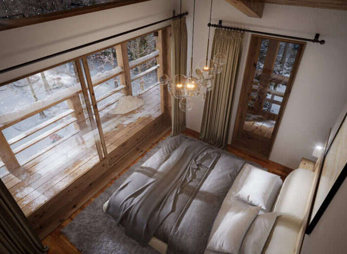 Cozy mountain cabin bedroom with stunning snowy views.