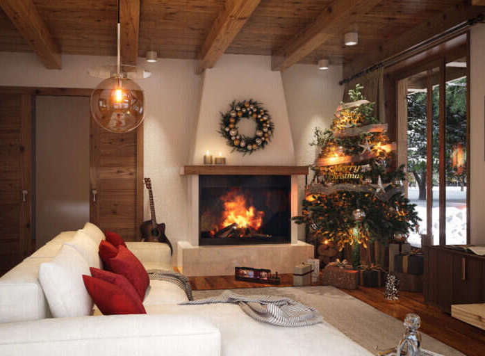 Cozy up by the fireplace in this stunning mountain chalet, complete with a beautifully decorated Christmas tree and comfortable seating.