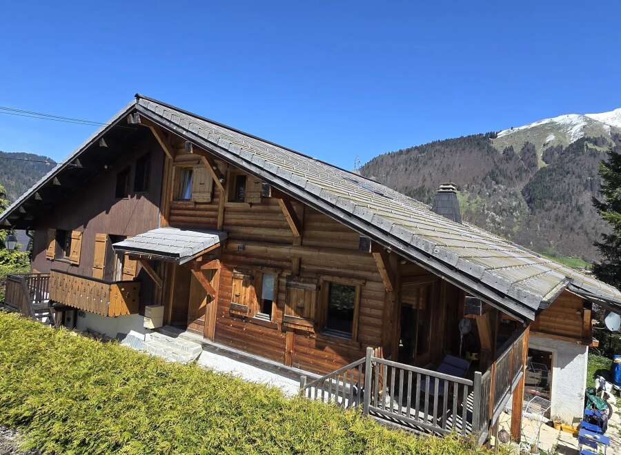 Nestled in a picturesque mountain setting, this charming wooden chalet offers a tranquil retreat.
