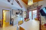 This charming apartment boasts a fully equipped kitchen, perfect for preparing meals after a day on the slopes.