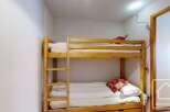 Cozy bunk beds in a charming room, perfect for a family getaway.