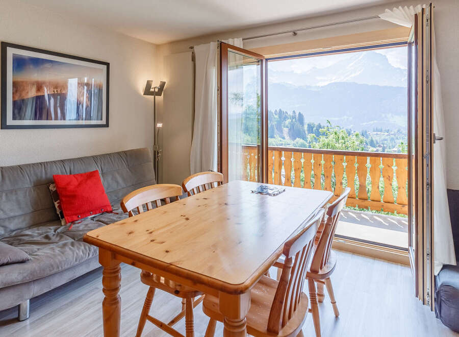 Enjoy breathtaking mountain views from this charming apartment.