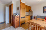 Cozy apartment with a fully equipped kitchen, perfect for preparing meals.