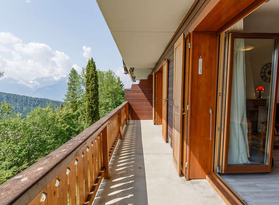 Enjoy breathtaking mountain views from this stunning balcony.