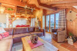 Experience the warmth of a cozy chalet with stunning mountain views.