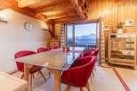 Experience breathtaking mountain views from this charming chalet.