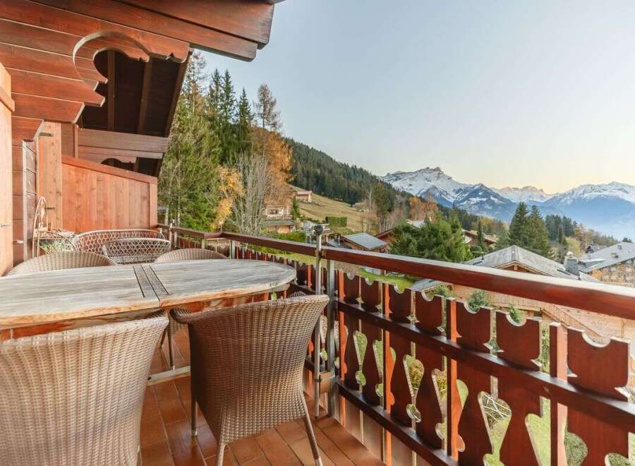 Enjoy breathtaking mountain views from this charming balcony.