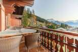 Enjoy breathtaking mountain views from this charming balcony.