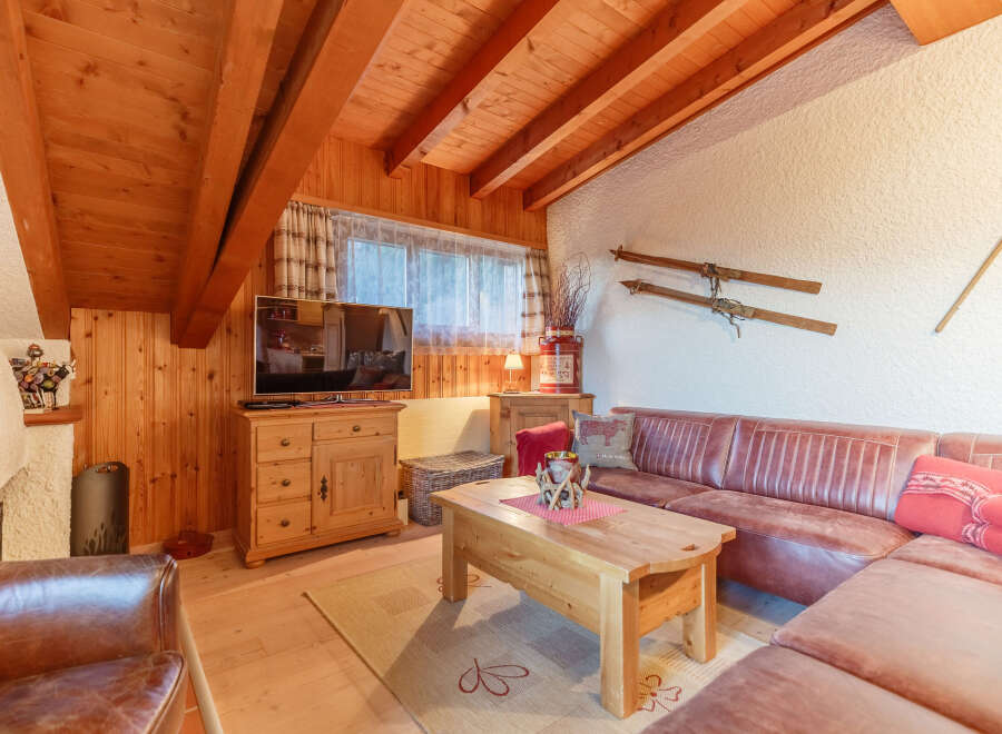 Cozy living room with wooden accents and a rustic charm.