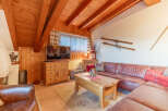 Cozy living room with wooden accents and a rustic charm.
