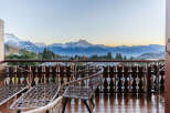 Enjoy breathtaking mountain views from this charming balcony.