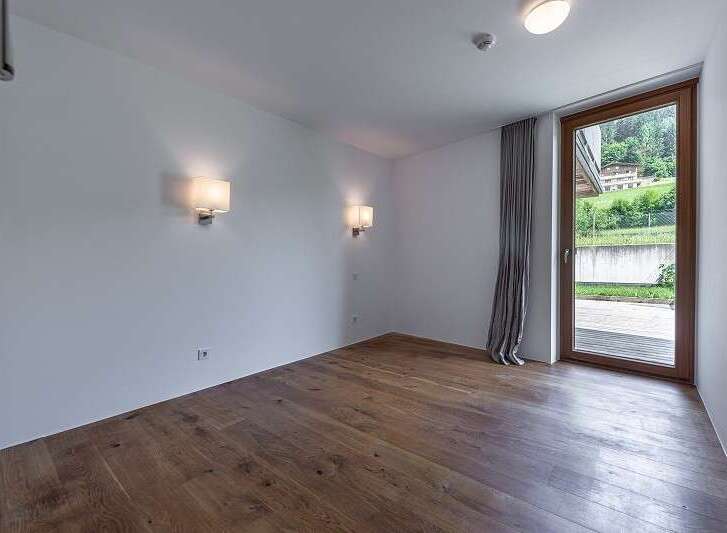 Discover a bright and airy room with beautiful hardwood floors.