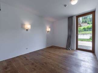 Discover a bright and airy room with beautiful hardwood floors.
