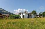 Discover a stunning modern home nestled in a picturesque landscape.