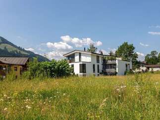 Discover a stunning modern home nestled in a picturesque landscape.