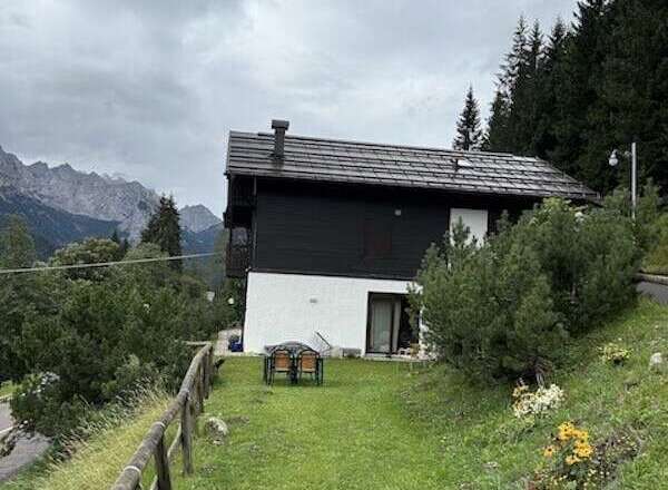 Nestled in a picturesque mountain setting, this charming property offers a tranquil escape.