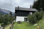 Nestled in a picturesque mountain setting, this charming property offers a tranquil escape.