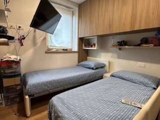 Cozy bedroom featuring two twin beds, perfect for guests or roommates.