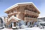 This stunning chalet boasts a beautiful exterior with a blend of wood and stone.