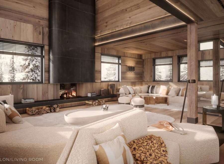 Luxurious chalet living room with a stunning fireplace and large windows offering breathtaking views.