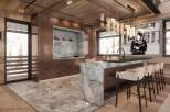 Luxury mountain kitchen with copper accents and marble island.