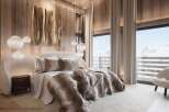 Luxurious master bedroom with stunning mountain views.