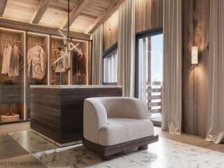 Luxurious master bedroom with walk-in closet featuring ample storage and built-in lighting.