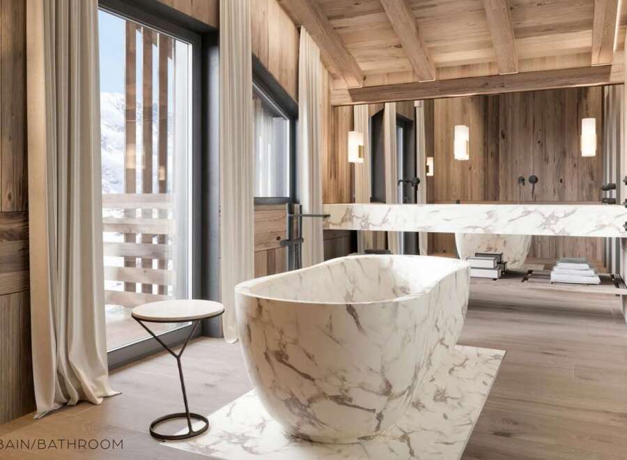Luxurious bathroom with marble bathtub and wooden accents.