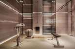 Luxury home gym with state-of-the-art equipment and serene design.