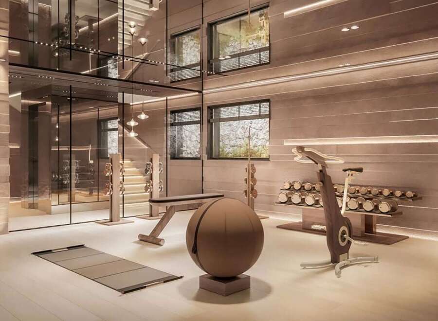 Luxury home gym with state-of-the-art equipment and stunning design.