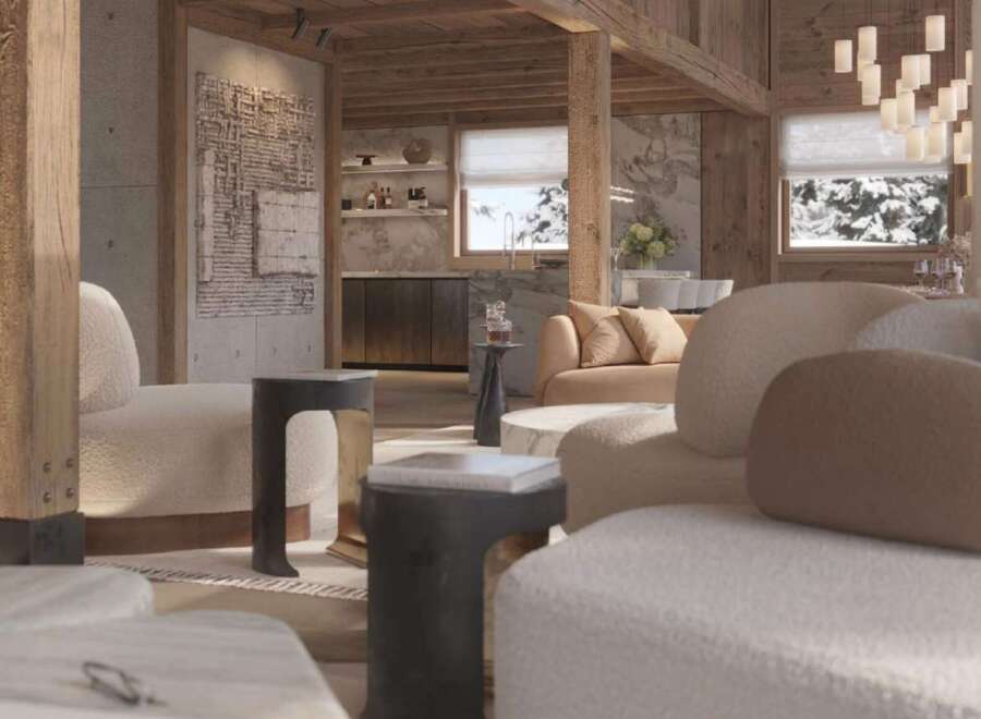 Luxurious chalet living room with stunning mountain views, featuring a cozy fireplace and plush seating.