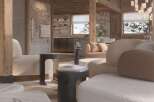 Luxurious chalet living room with stunning mountain views, featuring a cozy fireplace and plush seating.