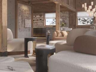 Luxurious chalet living room with stunning mountain views, featuring a cozy fireplace and plush seating.