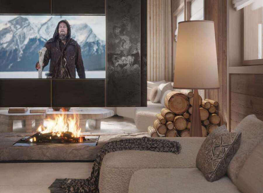 Cozy mountain chalet with a stunning fireplace and large screen TV perfect for movie nights.
