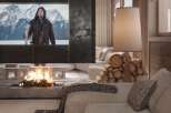 Cozy mountain chalet with a stunning fireplace and large screen TV perfect for movie nights.