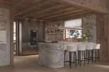 This stunning chalet boasts a luxurious kitchen with marble island and bespoke cabinetry.