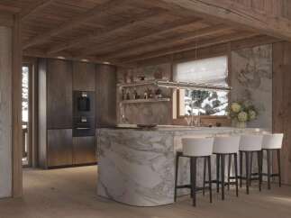 This stunning chalet boasts a luxurious kitchen with marble island and bespoke cabinetry.