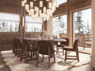 Luxurious chalet with stunning mountain views and a spacious dining area.