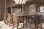 This stunning chalet boasts a spacious dining area perfect for gatherings, featuring a large wooden table surrounded by comfortable chairs.