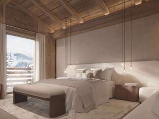 Luxurious chalet bedroom with stunning mountain views.
