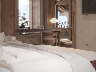 Luxurious chalet bedroom with stunning mountain views.
