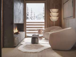 Cozy mountain chalet with stunning views and a modern fireplace.