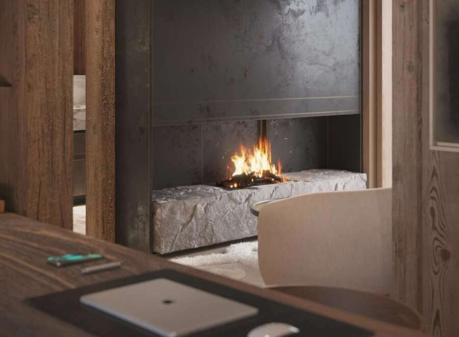 Cozy up by the fireplace in this stunning home office, featuring a unique stone hearth and modern design elements.
