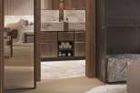 Luxury bathroom with marble vanity and wooden cabinetry, offering a serene and spa-like atmosphere.